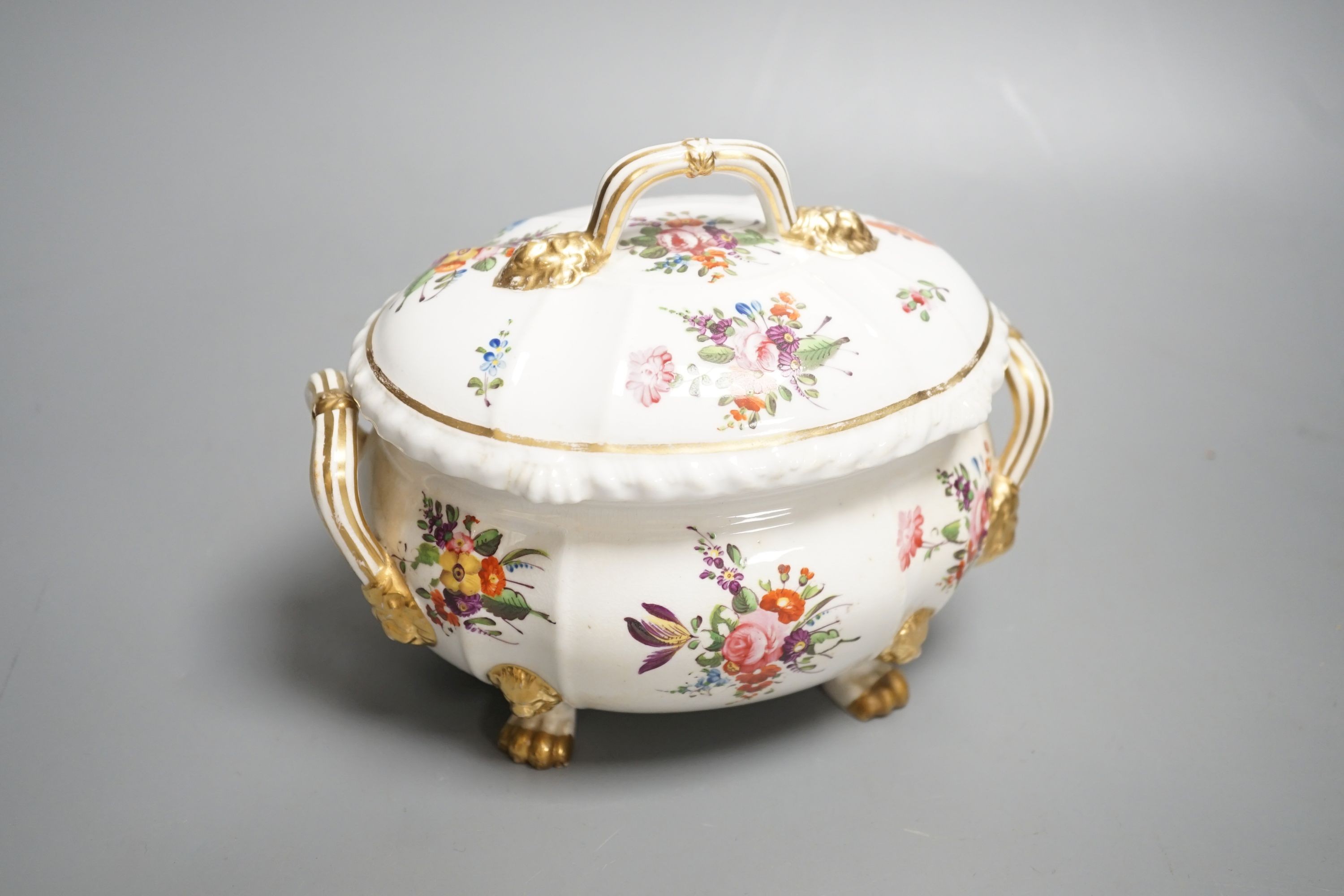 A Derby tureen and cover, early 19th century, on four feet with lion head masks painted with flowers, red mark, overall height 13.5cm